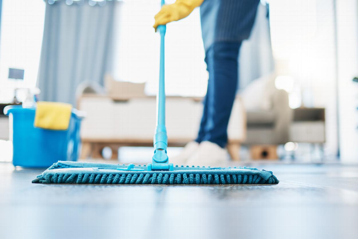 Cleaner mopping floor close up